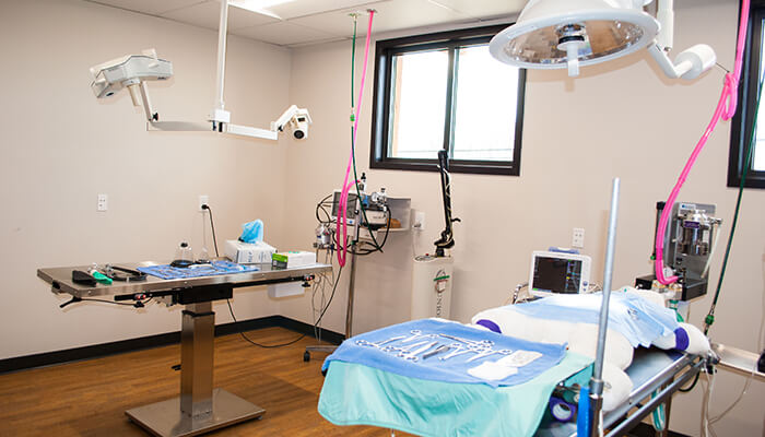 An examination room with table and medical instruments