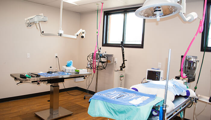 An examination room with table and medical instruments