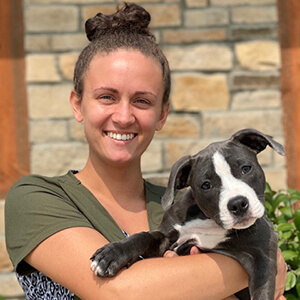 A woman holding a dog