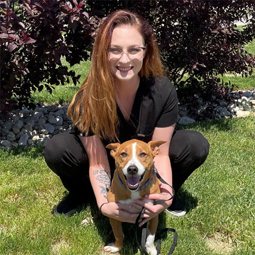 A woman holding a dog