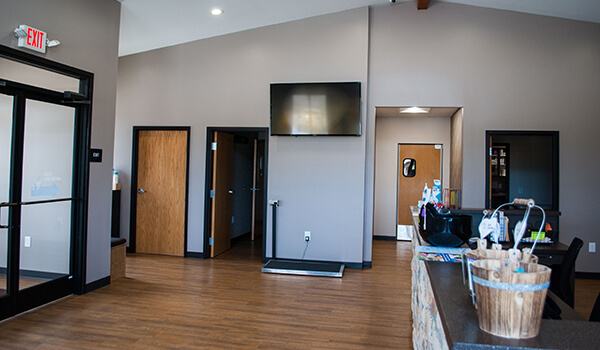 A front lobby area with a TV mounted to the wall